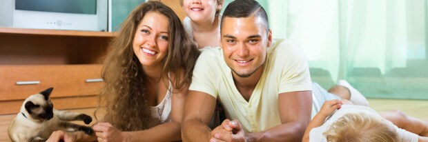 ASTHMA parents and two daughters with Siamese shutterstock