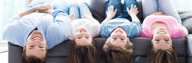 COMFORT lying upside down on sofa shutterstock